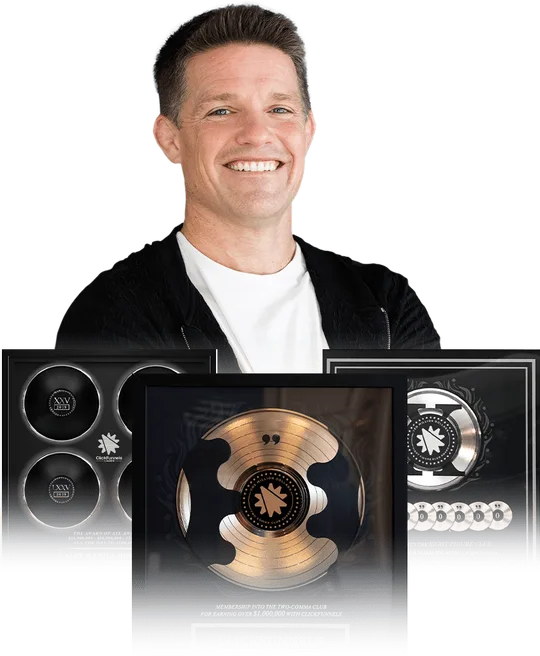 Russell Brunson with ClickFunnels Two Comma Club award plaques